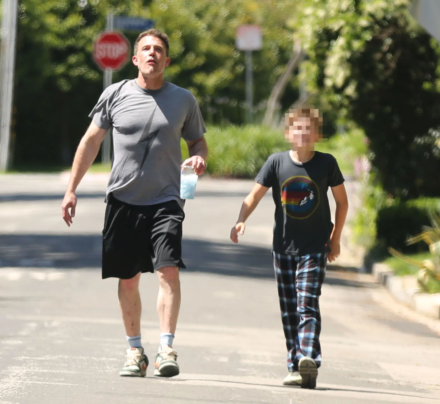 The actor chatted to 12-year-old Samuel, both dressed casually for the short stroll