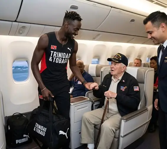 Cover Image for 💝 HEARTWARMING: The sports world is abuzz after top star Jereem Richards surprised passengers on a commercial flight with an incredibly kind gesture. According to eyewitness accounts, the renowned sprinter quietly gave up his first-class seat to an elderly American veteran just minutes before takeoff—but the story didn’t end there.
